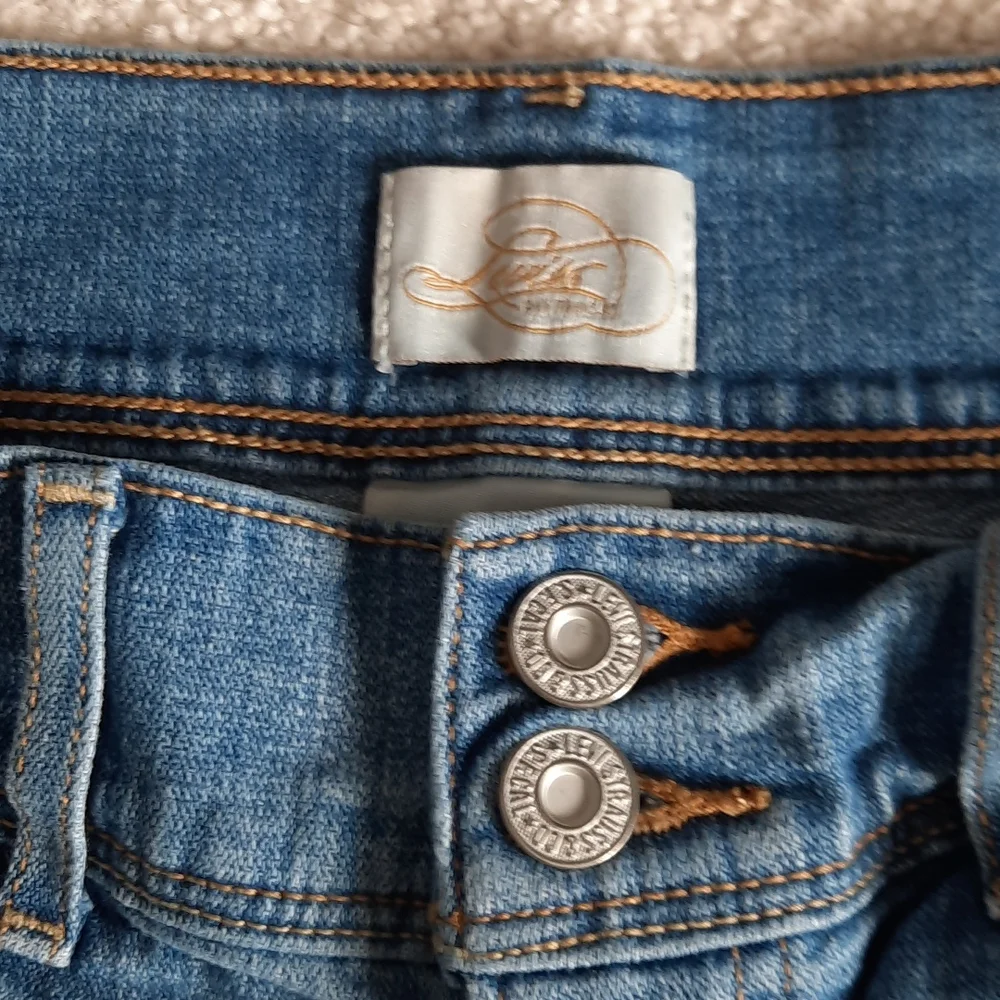 3 For $30. Levi's 515 Bermuda shorts